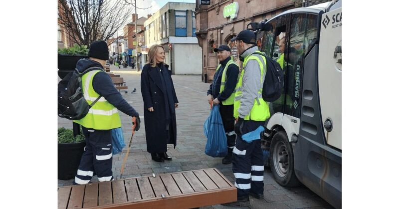 Jo Platt talking to workers in Leigh town centre.